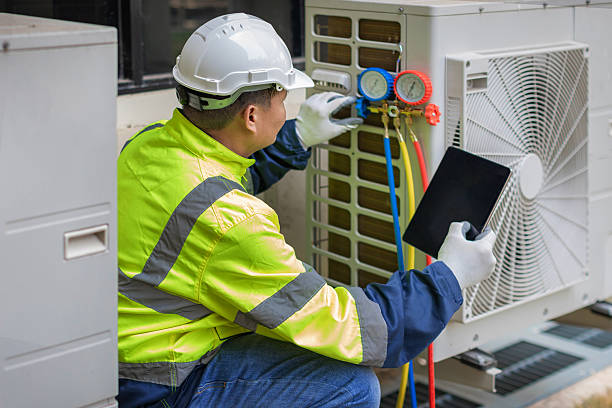Professional Air Duct Cleaning technician working in Munford, AL